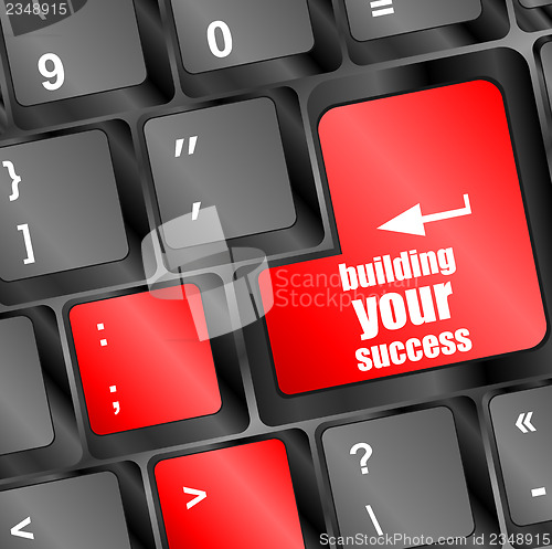 Image of building your success button on computer keyboard key