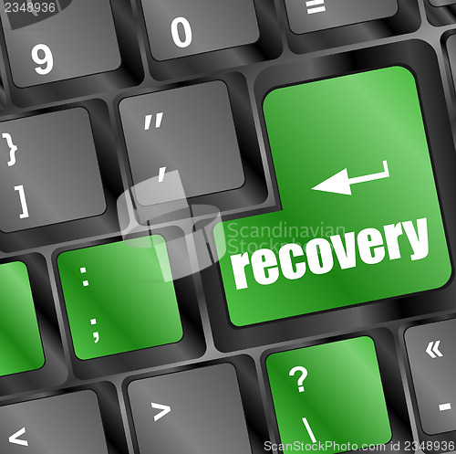 Image of key with recovery text on laptop keyboard button