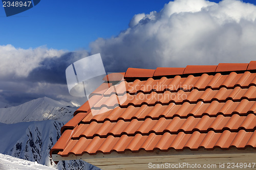 Image of Roof tiles against winter mountains