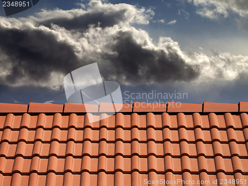 Image of Roof tiles and storm sky