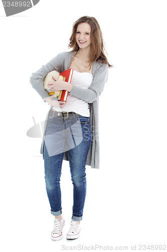 Image of Happy young student carrying her books