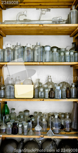 Image of Photo of an old laboratory with a lot of bottles