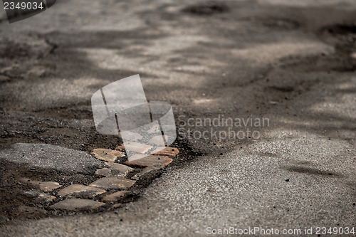 Image of Damaged car road with a lot of cracks