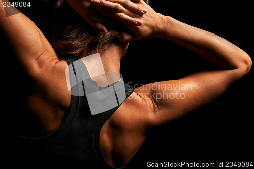 Image of Upper body of a muscular woman from the back