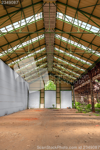 Image of Abandoned industrial interior with bright light