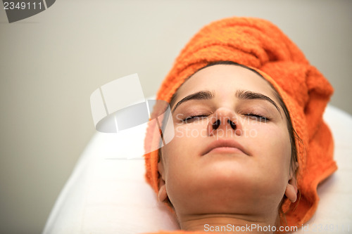 Image of Young woman in beauty salon