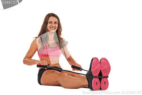 Image of Young woman in the studio streching