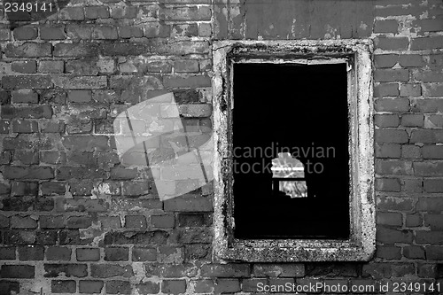 Image of Red brick wall with window