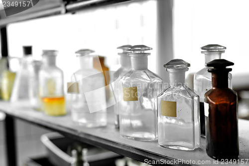 Image of Photo of an old laboratory with a lot of bottles
