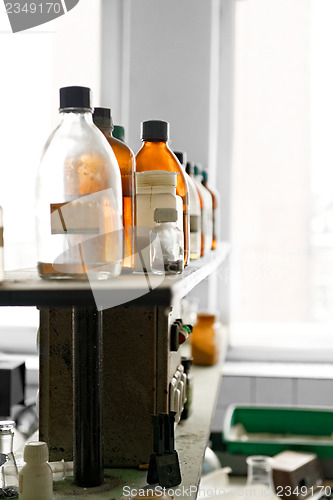 Image of Photo of an old laboratory with a lot of bottles