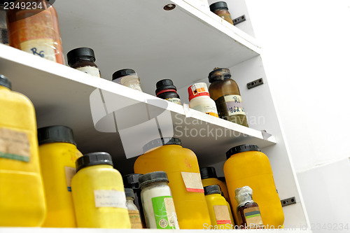 Image of Photo of an old laboratory with a lot of bottles
