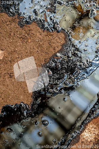 Image of Oil contaminating the soil