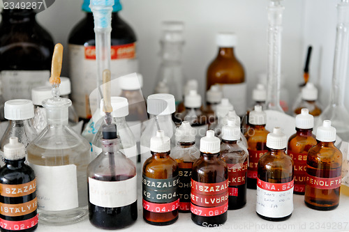 Image of Photo of an old laboratory with a lot of bottles