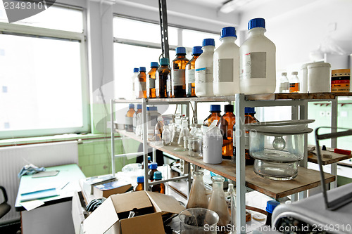 Image of Photo of an old laboratory with a lot of bottles