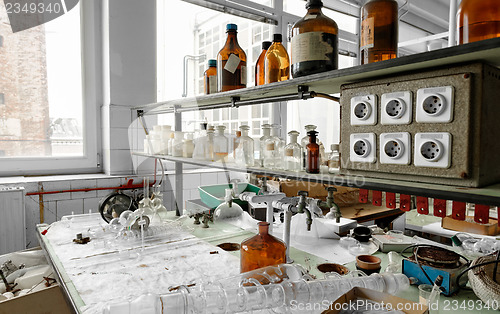 Image of Photo of an old laboratory with a lot of bottles