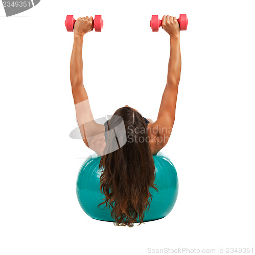 Image of Young woman with sport gymnastic ball