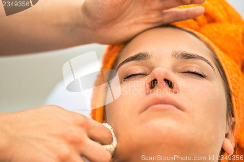 Image of Young woman in beauty salon