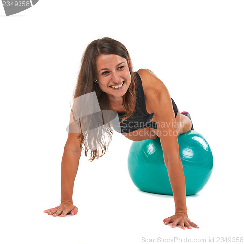 Image of Young woman with sport gymnastic ball