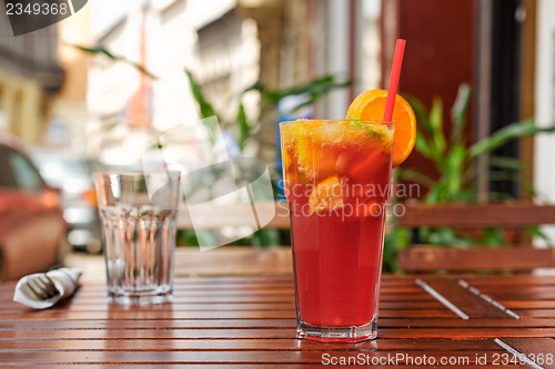 Image of Refreshing lemonade on wooden table