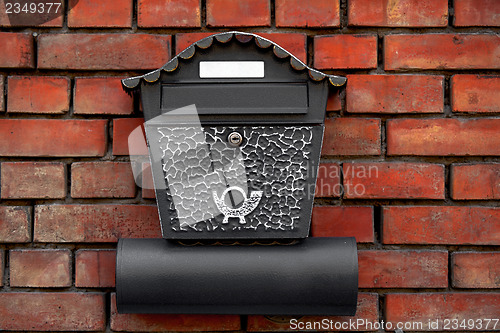 Image of Vintage postbox on brick wall