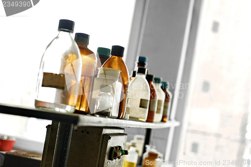 Image of Photo of an old laboratory with a lot of bottles
