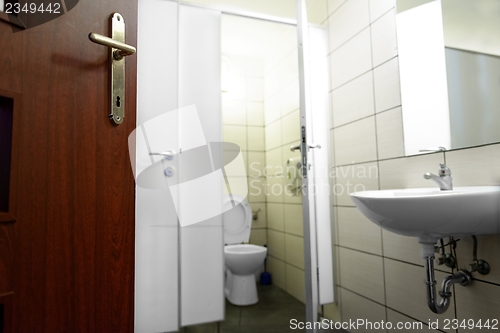 Image of Opened door with toilet