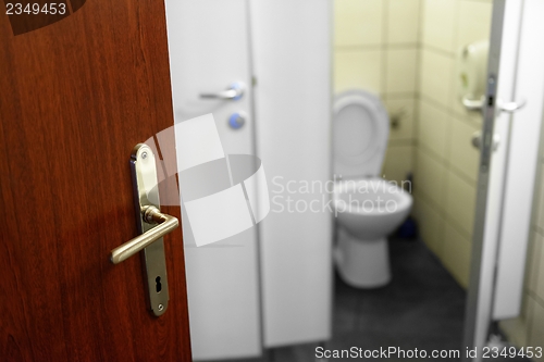 Image of Opened door with toilet