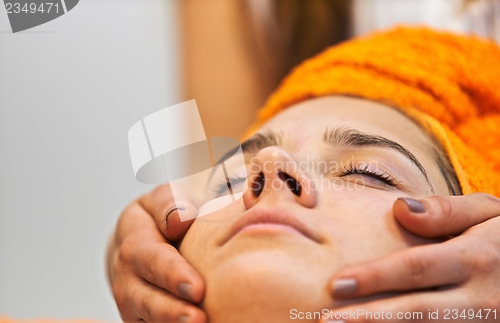 Image of Young woman in beauty salon