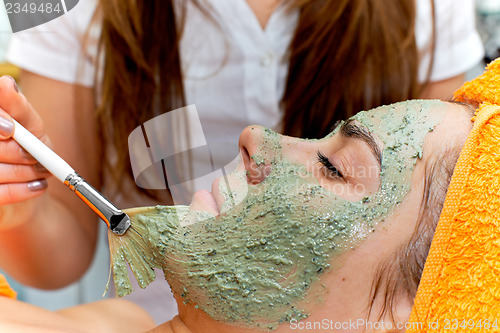 Image of Young woman in beauty salon