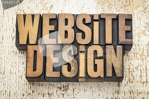Image of website design in wood type