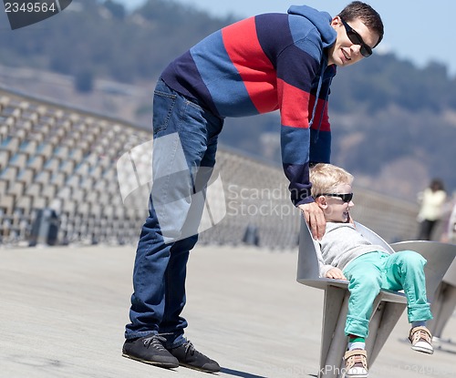 Image of family of two outside