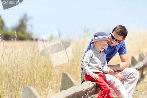 Image of family of two outside