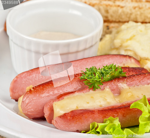 Image of sausages with cheese and omelette