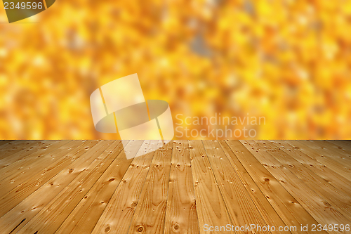 Image of wooden floor and defocused autumn forest