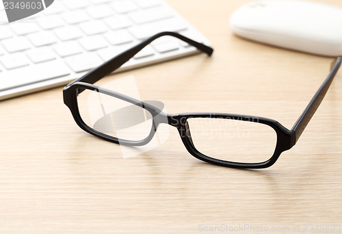 Image of Keyboard, mouse and glasses