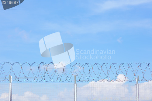 Image of Chain link fence with barbed wire