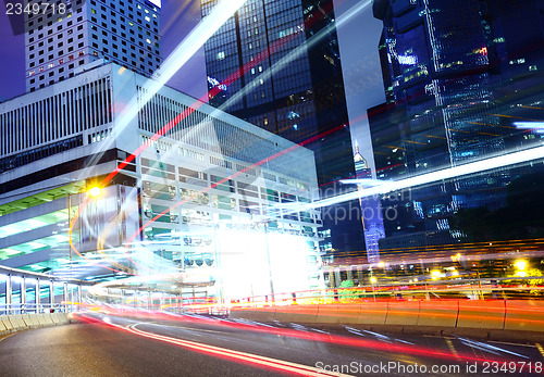 Image of City at night with busy traffic