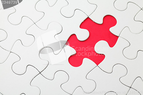 Image of Missing puzzle piece in red 
