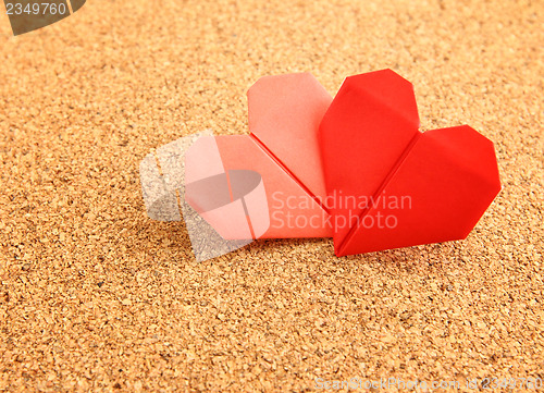 Image of Origami colorful heart on corkboard