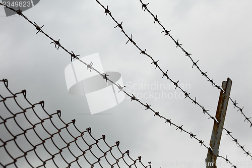 Image of Chain link fence with barbed wire 