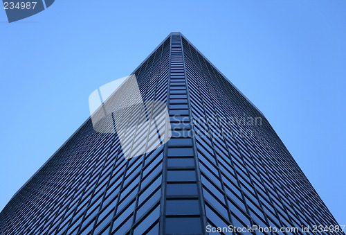 Image of Angle view of a glass-windowed office tower