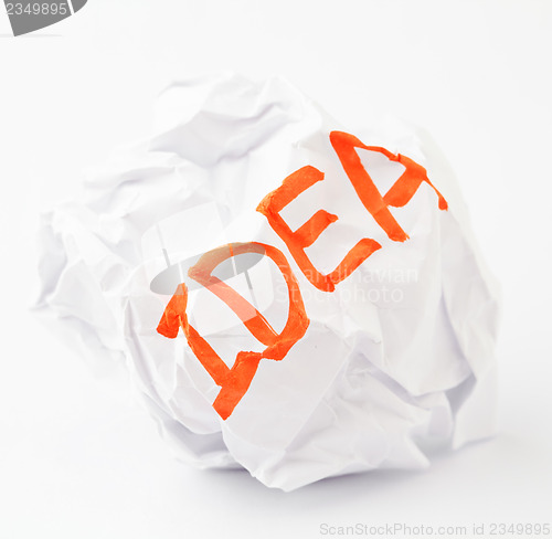 Image of Crumpled paper ball with word idea