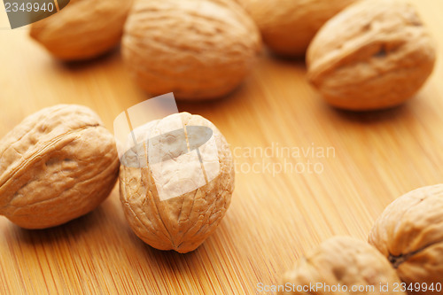 Image of Walnut on wooden table 