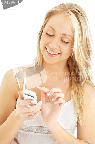 Image of teenage girl with a white phone