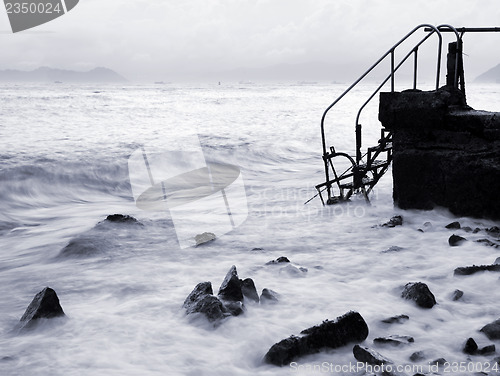 Image of Jetty on sea at sunset