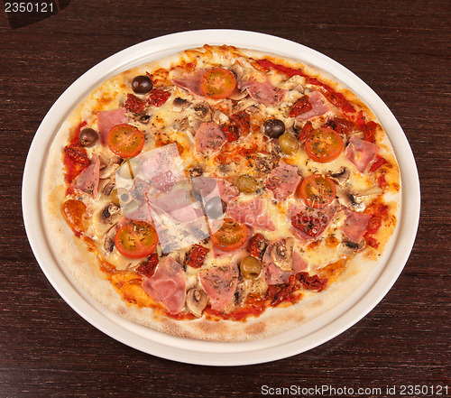 Image of pizza with ham and mushrooms