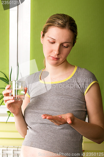 Image of Cute Pregnant Woman On Kitchen