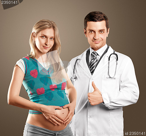 Image of Pregnant Woman With Doctor