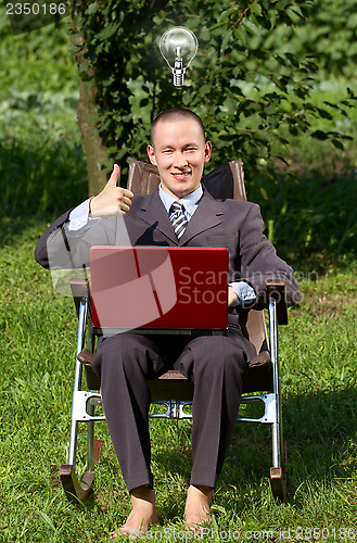 Image of Businessman Working Outdoors