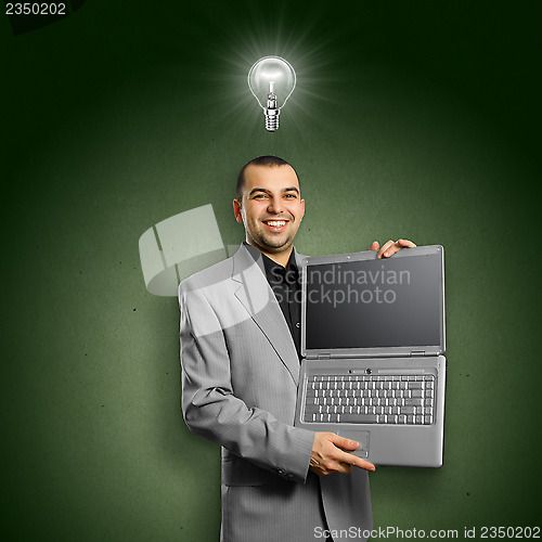 Image of Idea Concept businessman with open laptop in his hands